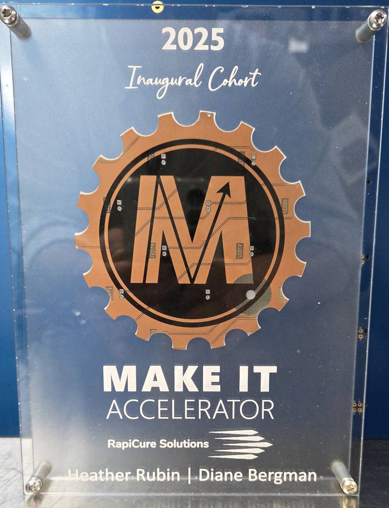 Circuit Board Award with 'Make It Accelerator' logo and text on a reflective surface